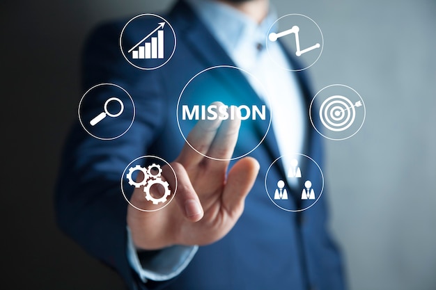 Business professional touching mission text on virtual screen